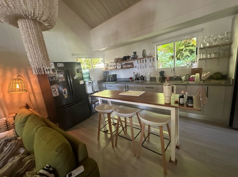 Living room and kitchen area in Casa Mia beach home for sale in Costa Rica